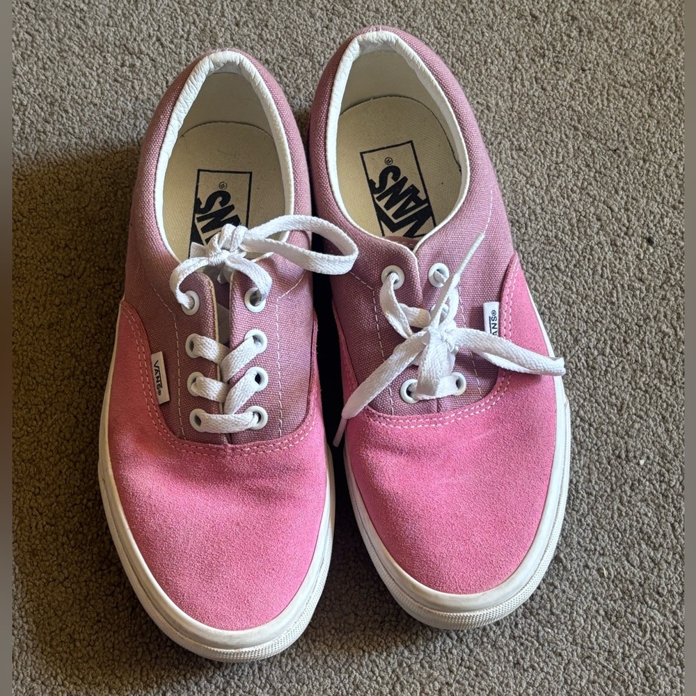 Pink Vans shoes.